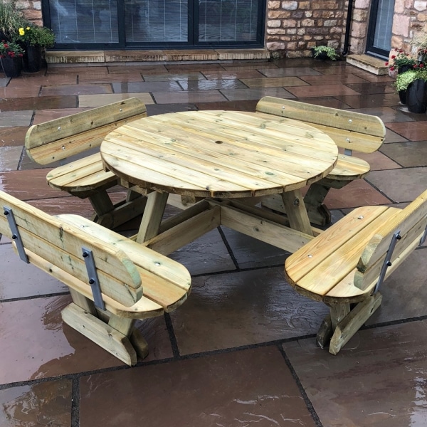 Traditional round wooden picnic table with seatbacks and rounded edges to seat 8 people