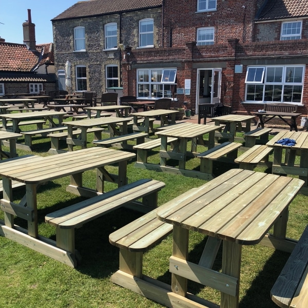 Wooden walk-in picnic tables for 8 people in a pub garden