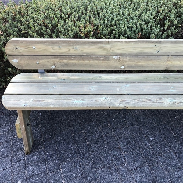 Classic park style wooden bench with rounded edges and back rest