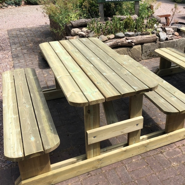 H-frame wooden picnic table seating 8 with rounded edges